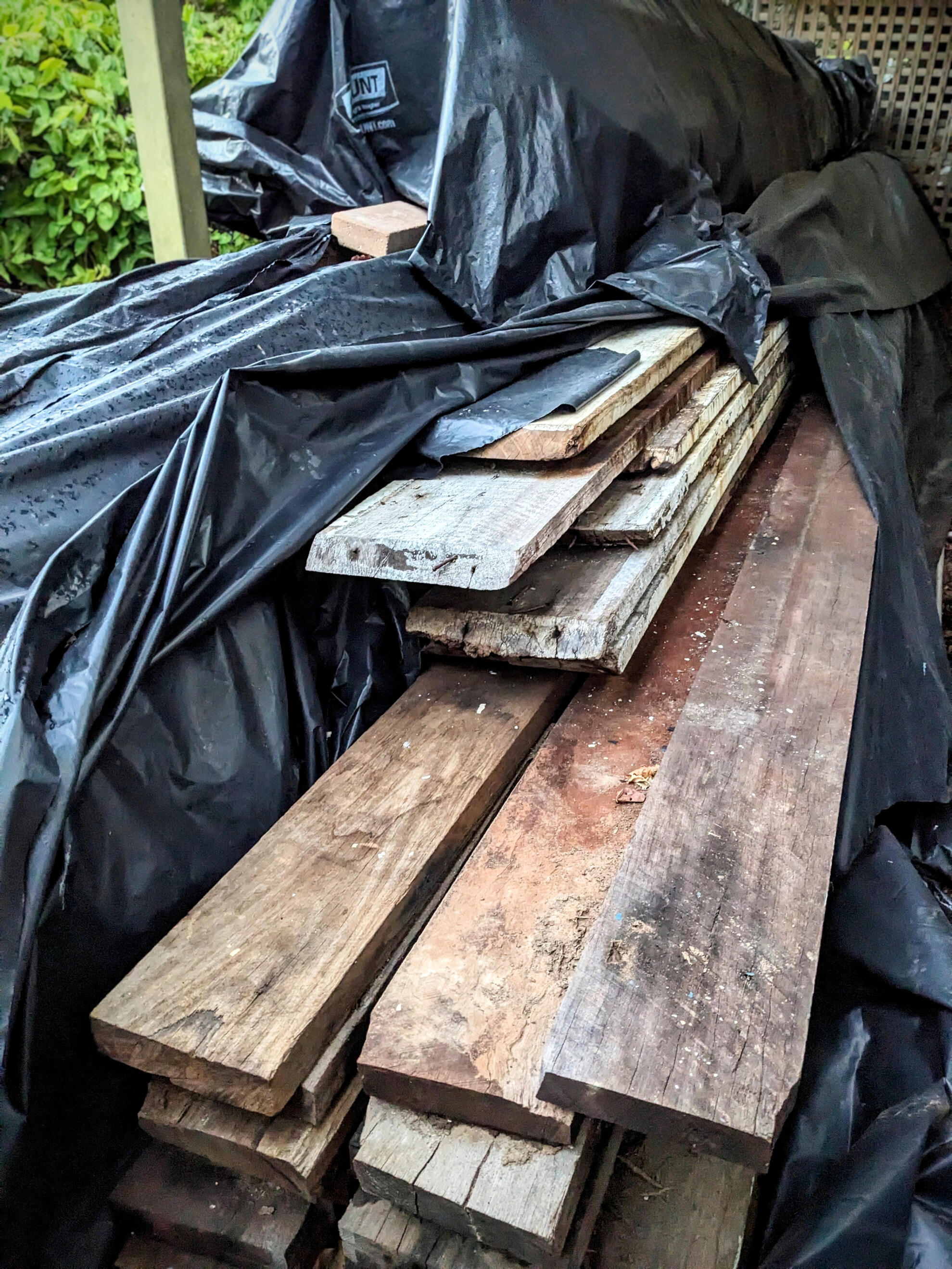 Recycled Timber Awaiting Reuse Studio Violett Oxley Farmhouse recycled timber awaiting reuse as cladding and structural elements highlighting sustainable craftsmanship